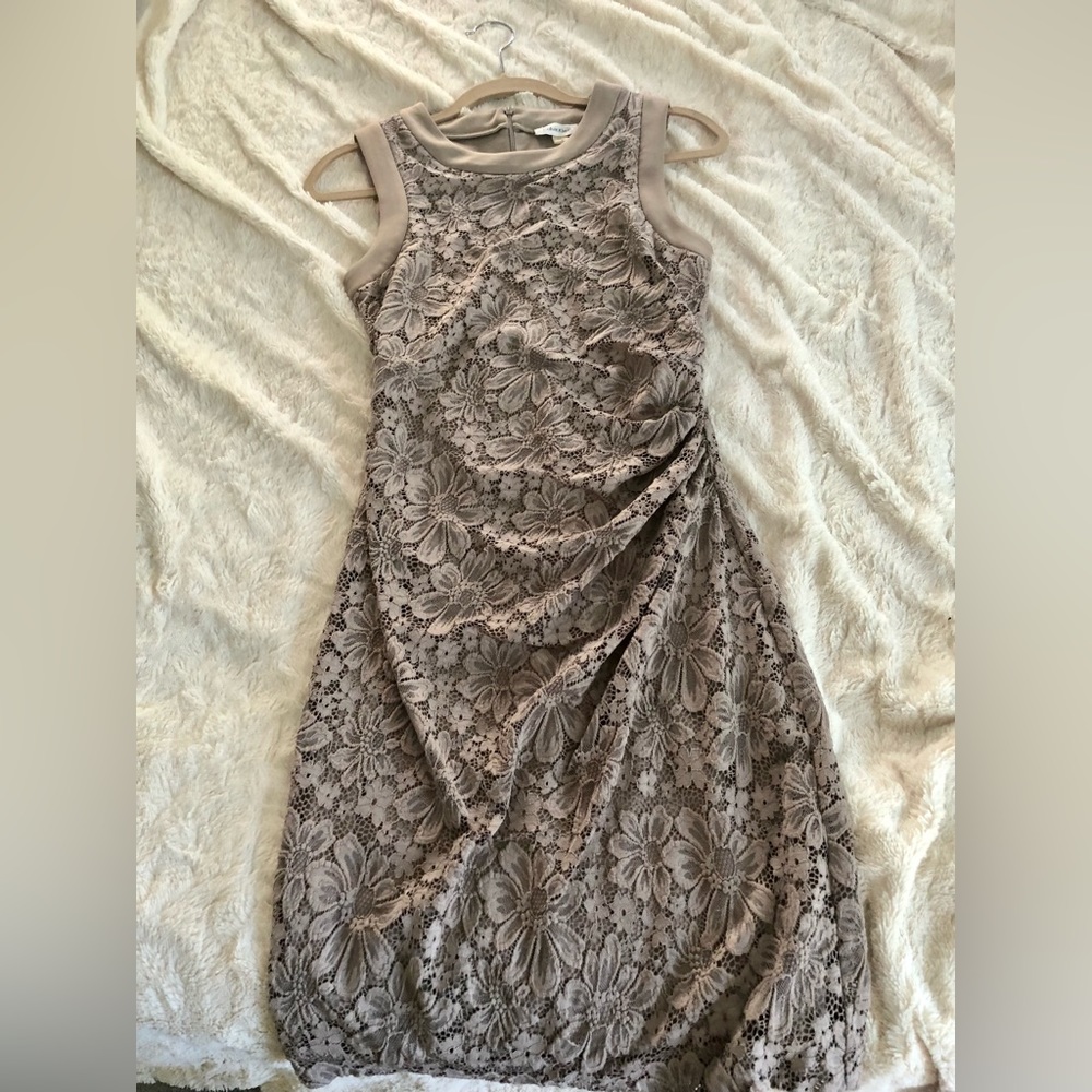 Knee length, beautiful details, classy color. Used once!